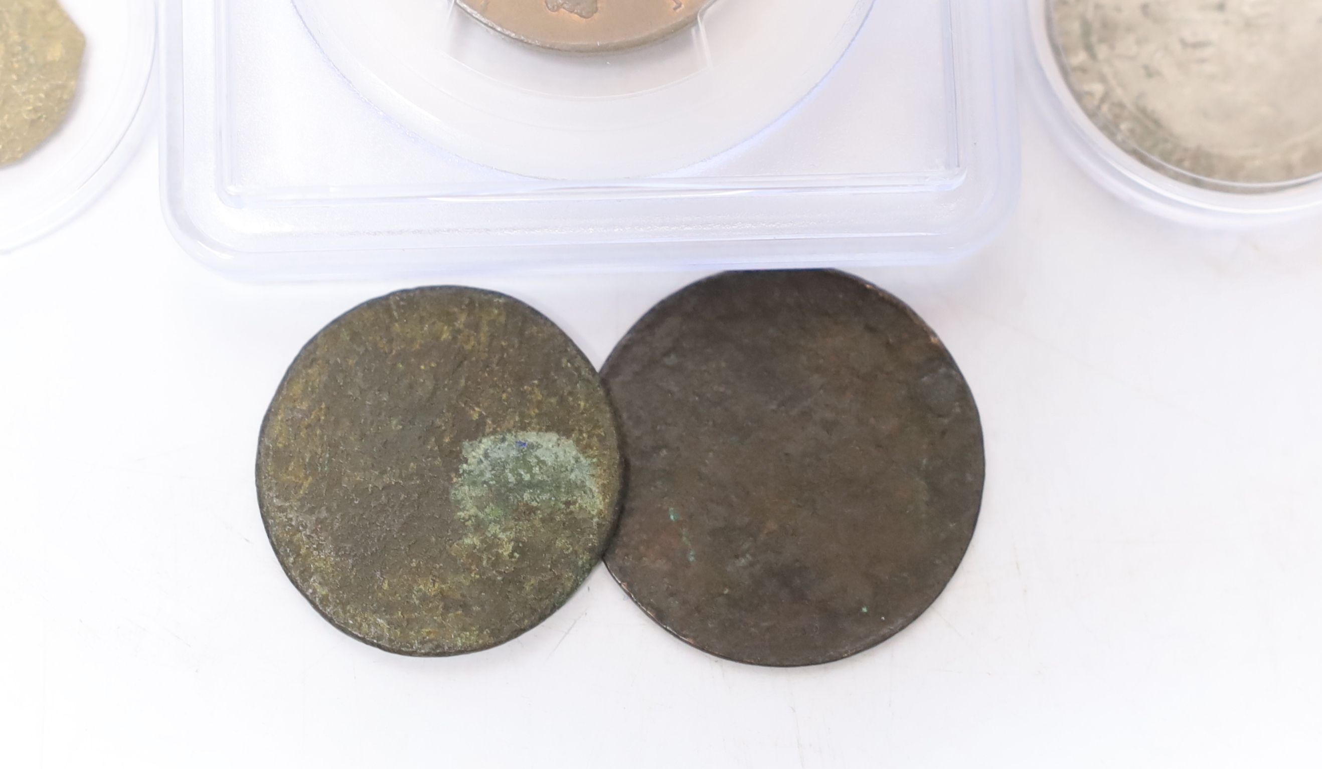 Seven coins including; a Charles II 1663 shilling, an Edward VI silver shilling, a George II 1735 half penny (PCGS graded MS65BN) together with four other coins
